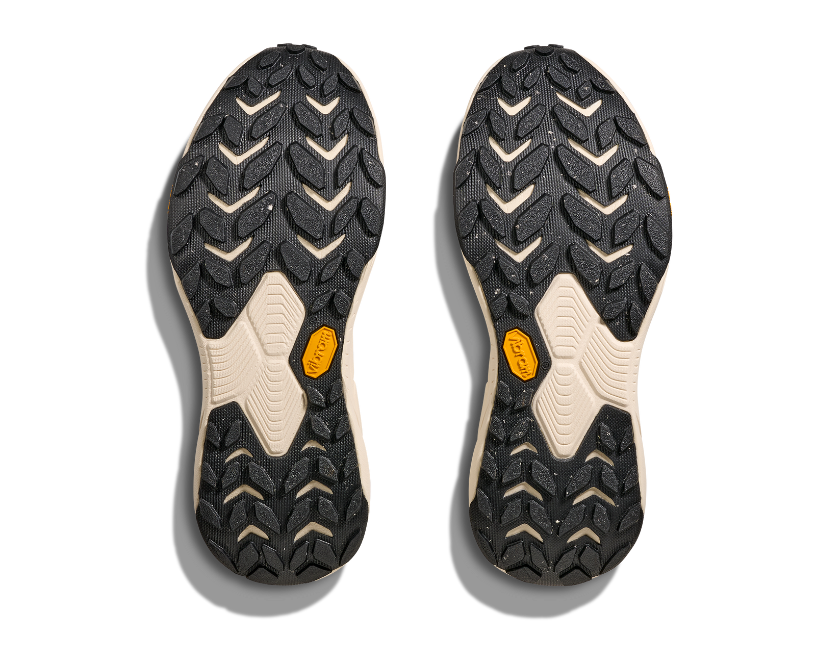 Close-up of a pair of black and beige shoe soles