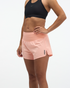 hoka womens glide short mr 3.5 brief, lightweight running short, solid peach colour, woman wearing short with black sports bra on white background