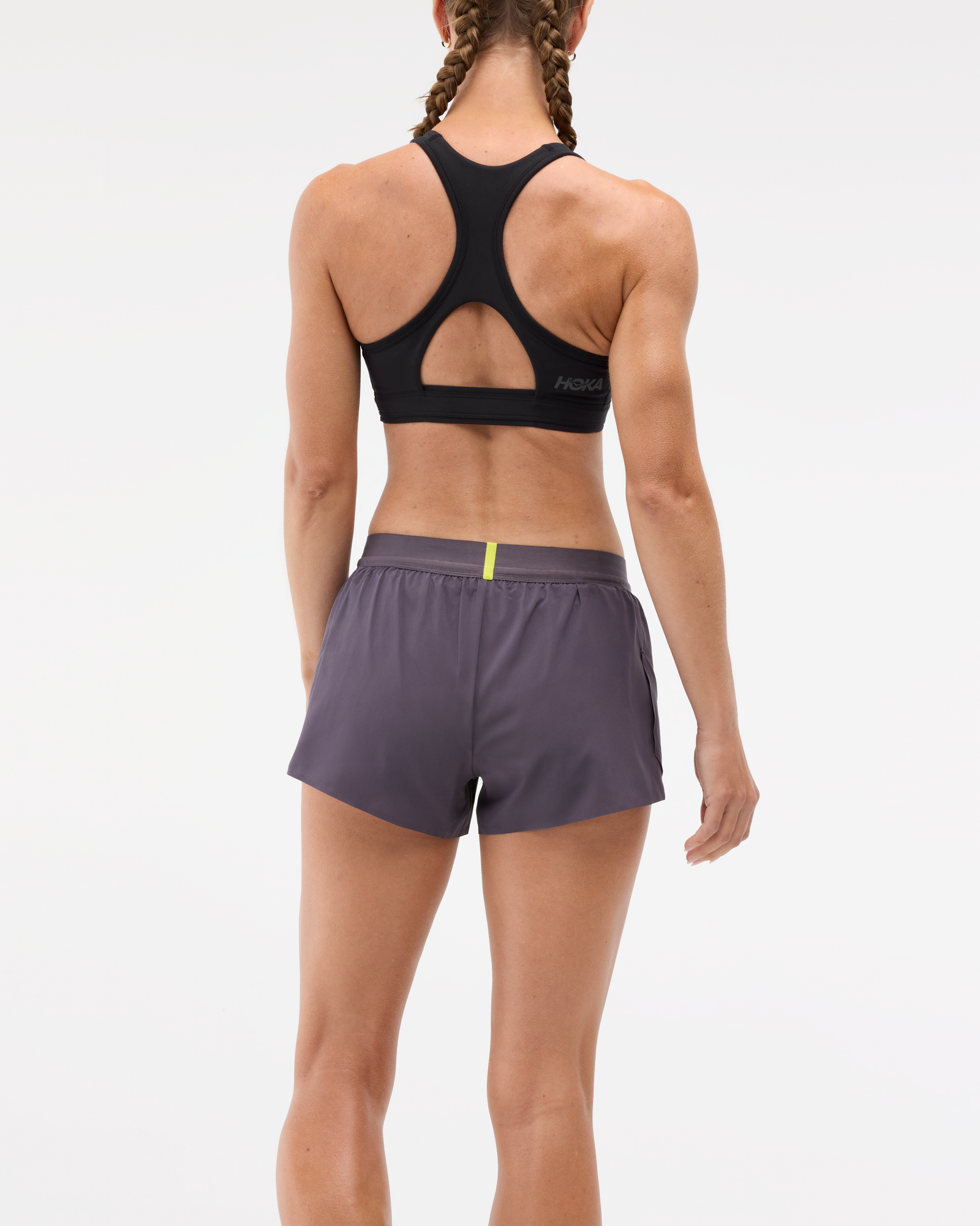 Womens Hoka race day split short in the squid ink colourway. Picture of model wearing shorts. 