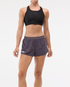 Womens Hoka race day split short in the squid ink colourway. Picture of model wearing shorts. 