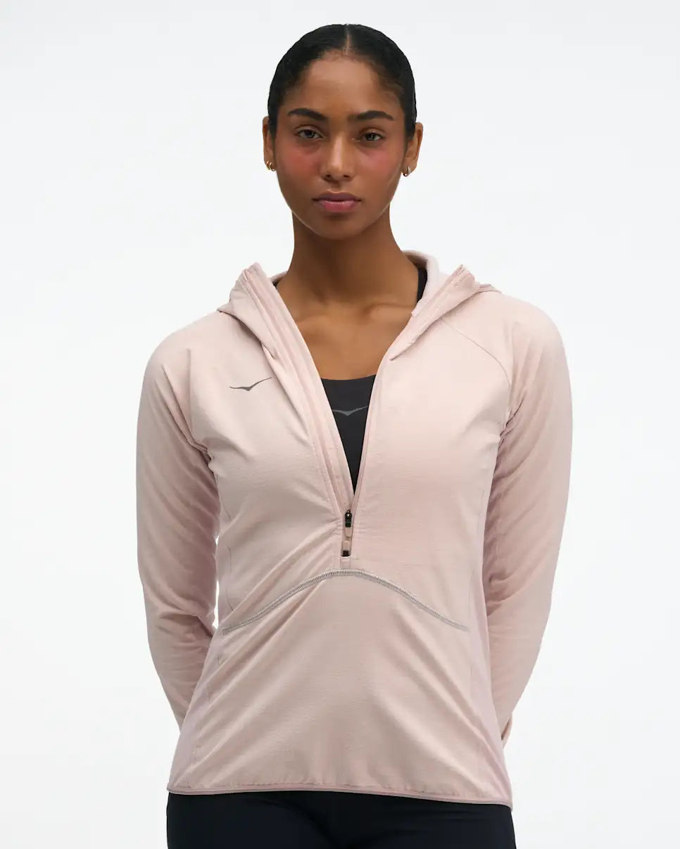 hoka womens skyglow half zip running top, short zip water resistant stretchy hooded top, front view of top in a pink colour