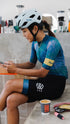 woman wearing kask mojito helmet in sea ice, light blue colour