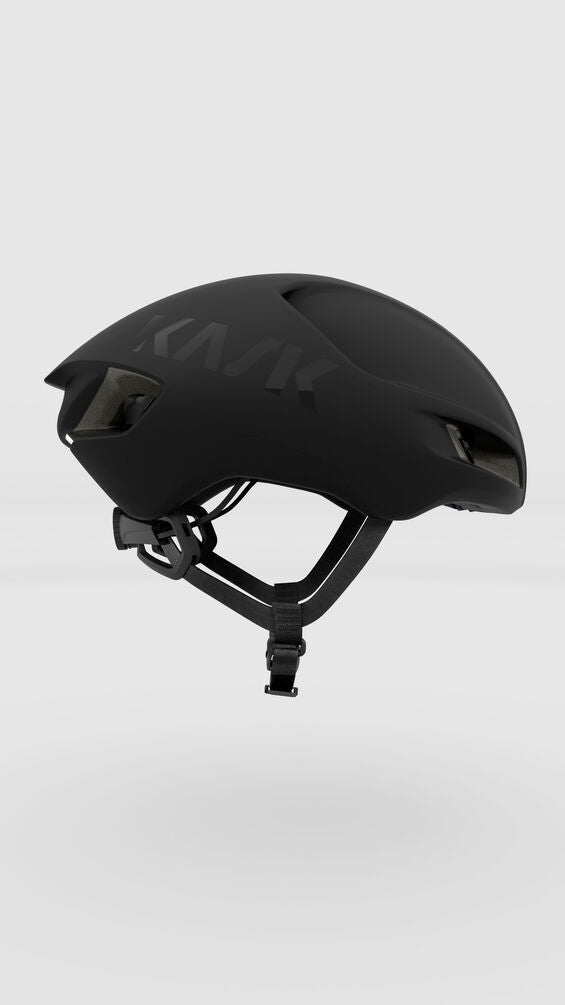 kask utopia y helmet, black matte color, aerodynamic road helmet, side profile of helmet on white background