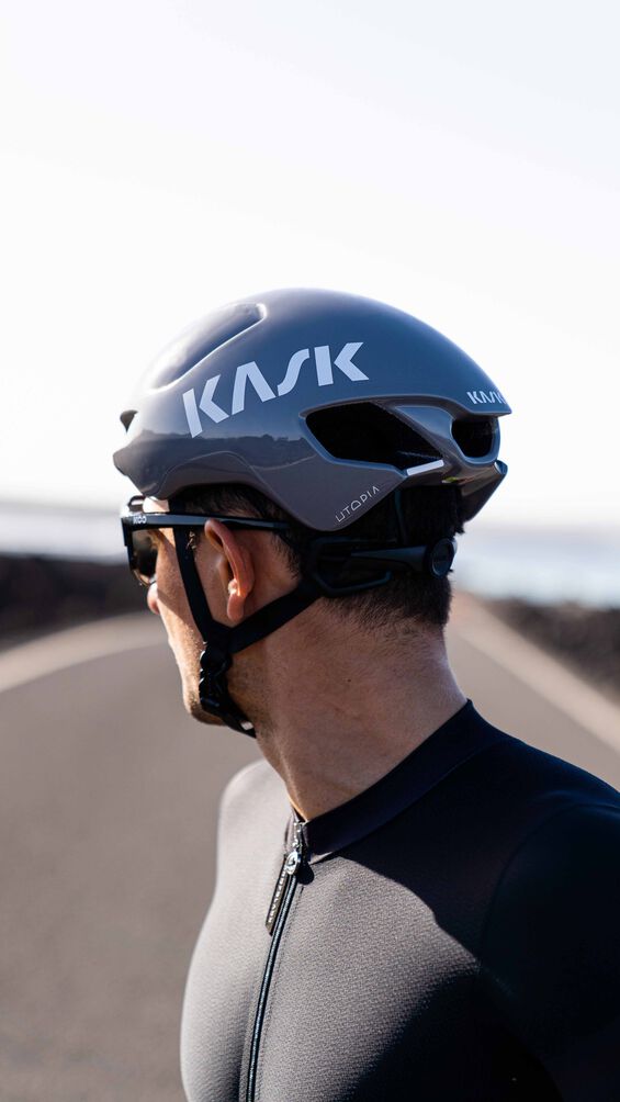 man wearing kask utopia y cycling helmet, blue colour