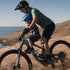 Kids Ride Shotgun 2.0 Child Bike Seat + Handlebars Combo, woman riding bike with child on hill with long grass