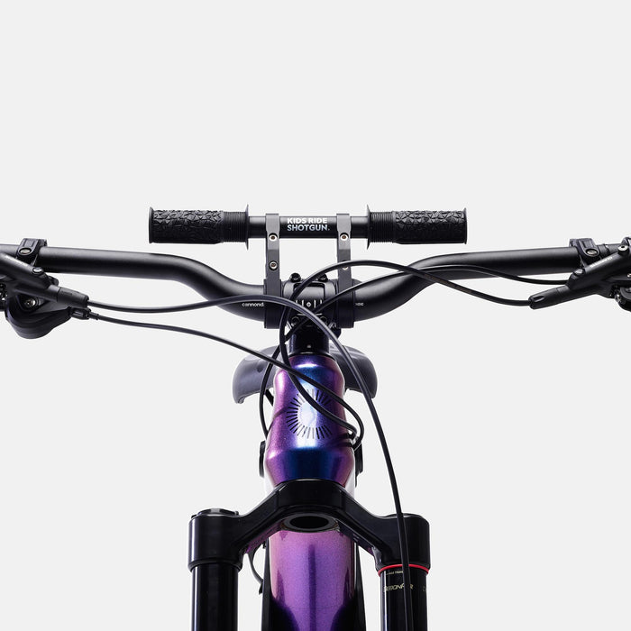 Kids Ride Shotgun 2.0 Child Bike Seat + Handlebars Combo close up on purple bike front angle