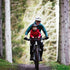 Kids Ride Shotgun Child Bike Seat + Handlebars Combo, woman riding bike with child on seat through forest with helmets