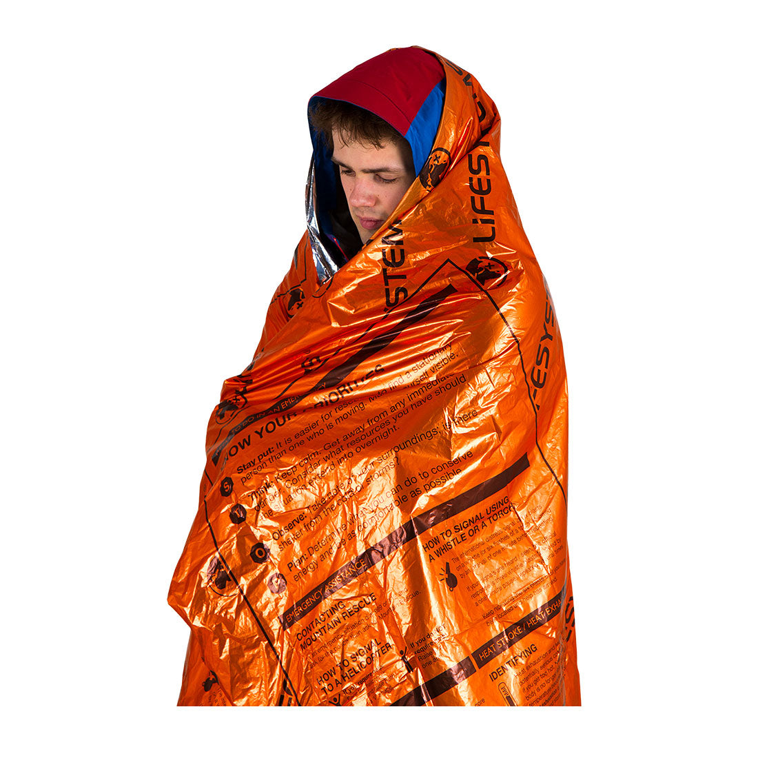 Person wrapped in an orange emergency blanket with visible branding