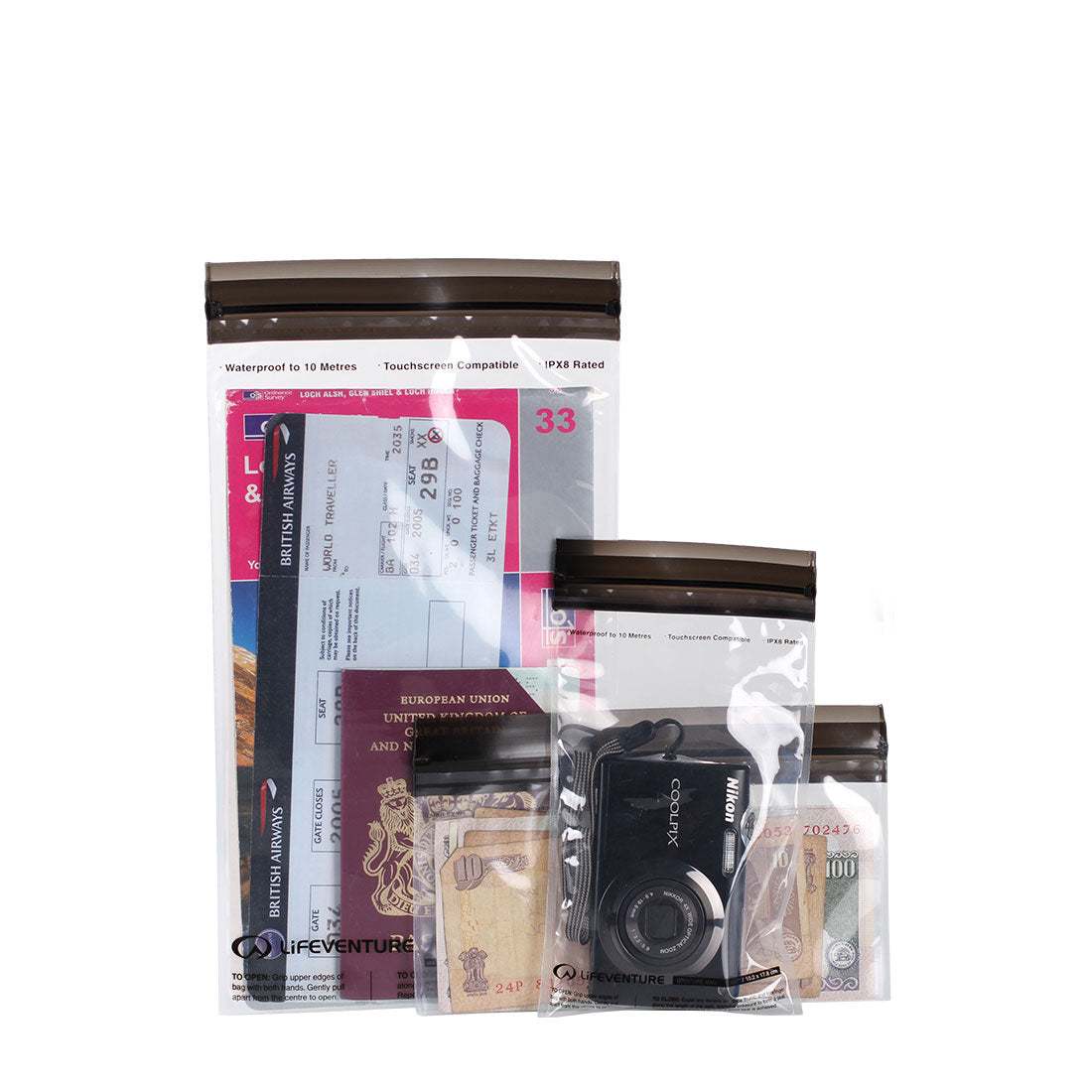 Clear travel organiser bag with passport, camera, and other items on a white background