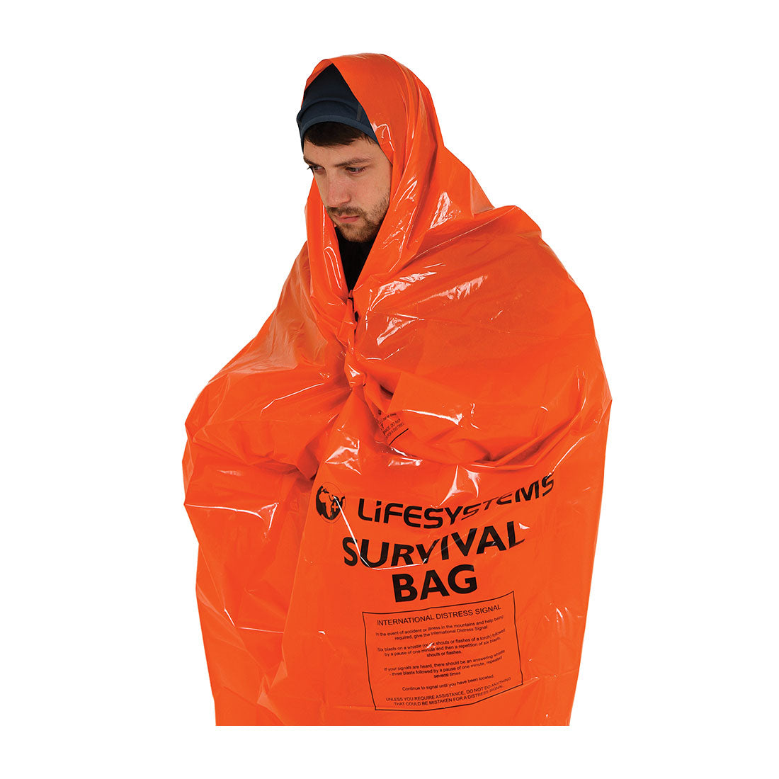 Person wearing an orange survival bag with 'Lifesystems' branding 