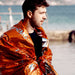 man with thermal blanket