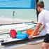 image of a man next to an assortment of lifeventure ultralight dry bags being used on a boat