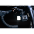 moon titan max bike light, small square bike light under handlebars, light turned on with dark background