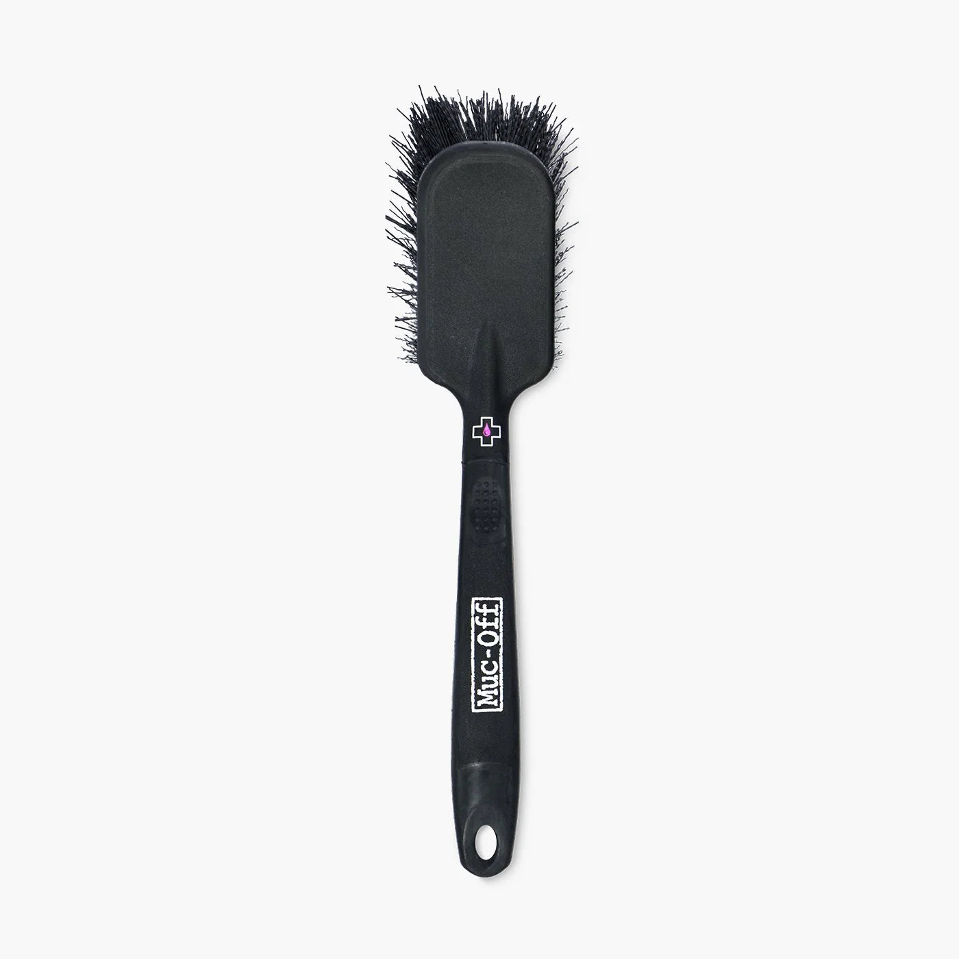 muc off tyre and cassette brush, back of black brush with white logo