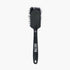 muc off tyre and cassette brush, back of black brush with white logo