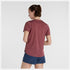 woman wearing nb athletics run tee in washed burgundy colour, showing back