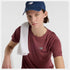 woman wearing nb athletics run tee in washed burgundy colour, 