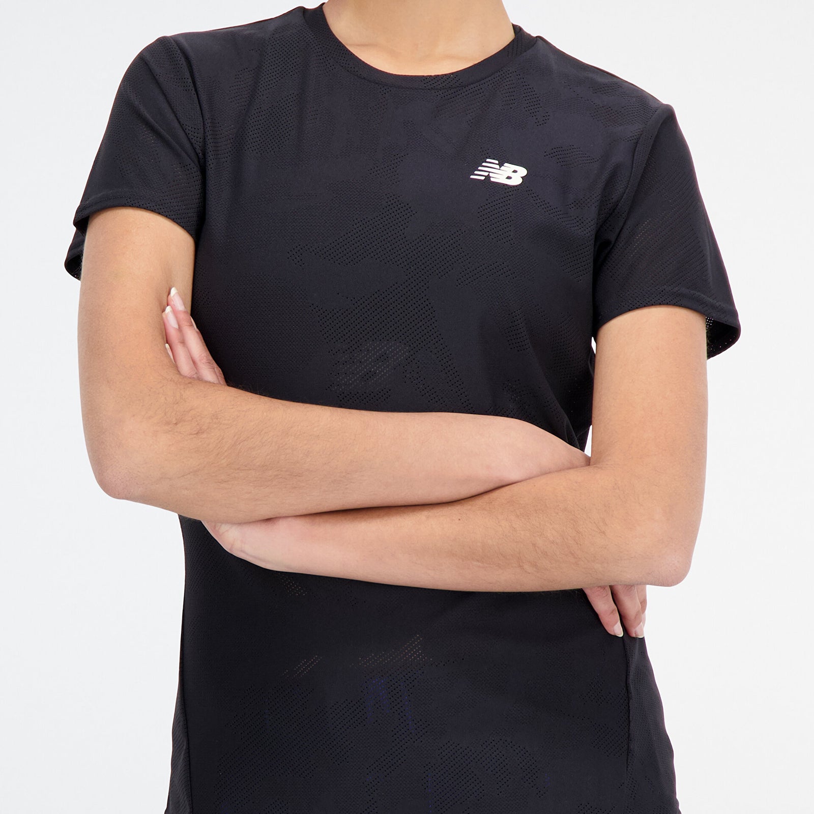 Woman wearing new balance jacquard short sleeve tee in black, close up