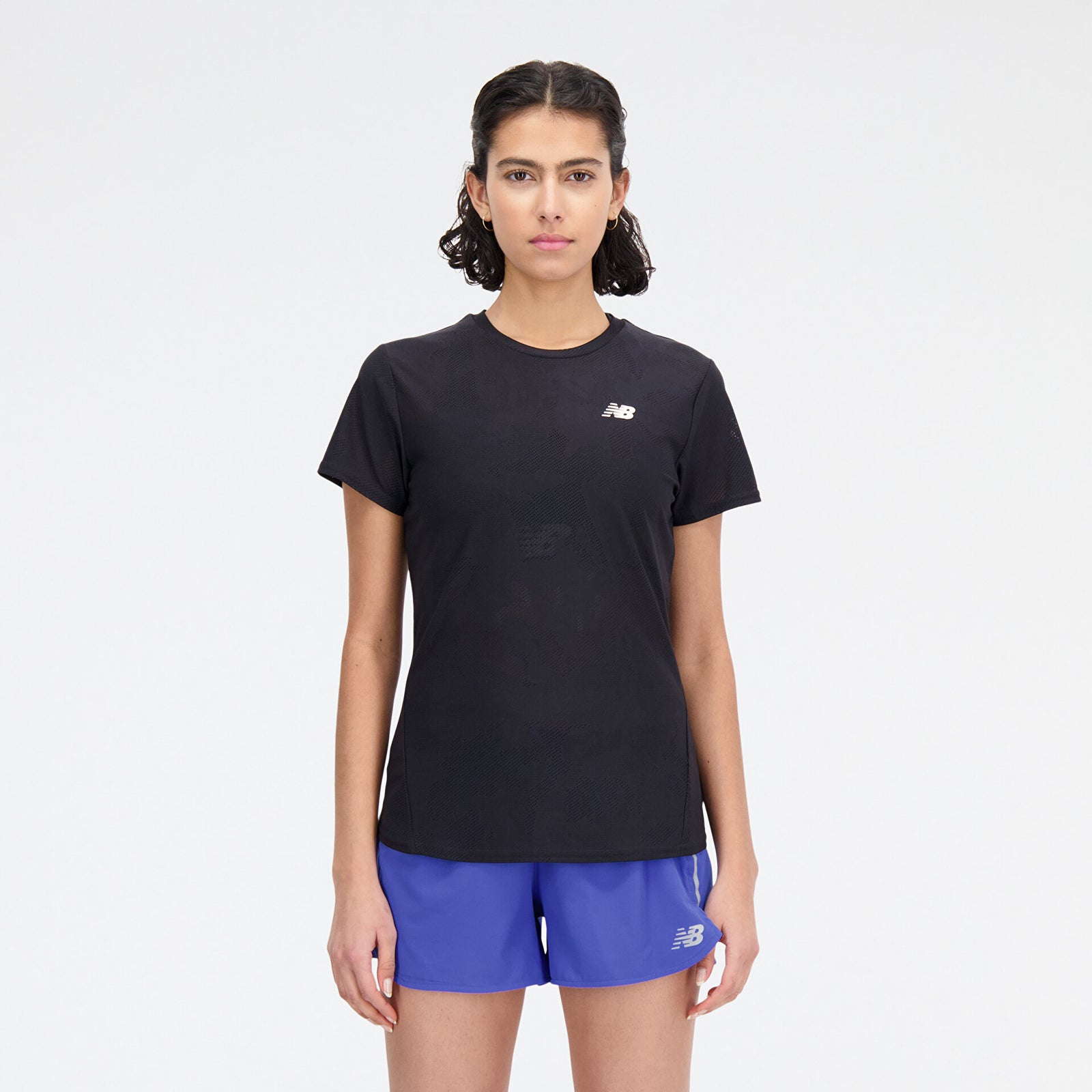 Woman wearing new balance jacquard short sleeve tee in black