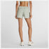 Woman wearing new balance 5 inch rc short in light green colour