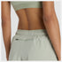 Woman wearing new balance 5 inch rc short in light green colour
