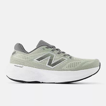 light green new balance running shoe with grey New Balance logo and details