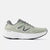 light green new balance running shoe with grey New Balance logo and details