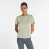 new balance short sleeve shirt for women, lightweight breathable tshirt, light green colour, model wearing shirt and light grey leggings