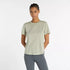 new balance short sleeve shirt for women, lightweight breathable tshirt, light green colour, model wearing shirt and light grey leggings
