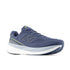 new balance fresh foam 1080v15, soft bouncy lightweight road running shoe for men, indigo colour with bright green accents, profile of shoe on a white background