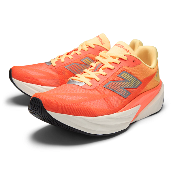 mens new balance fuel cell rebel version 5 in the tangerine heat colour, light, bouncy daily trainer, top down side profile.
