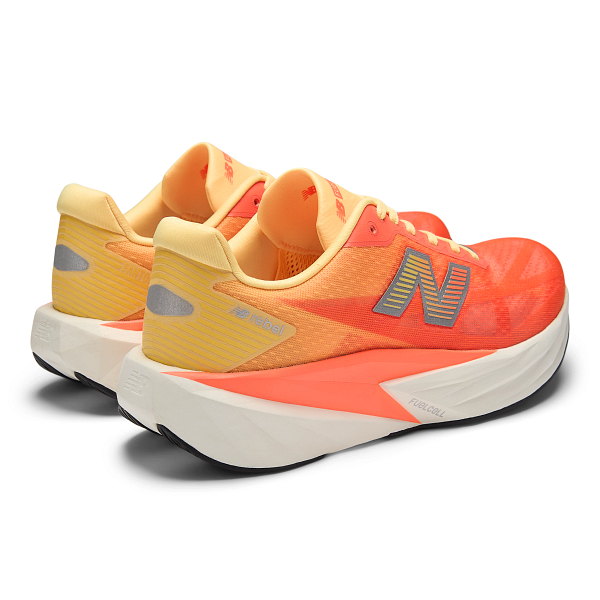 mens new balance fuel cell rebel version 5 in the tangerine heat colour, light, bouncy daily trainer, top down rear side profile.