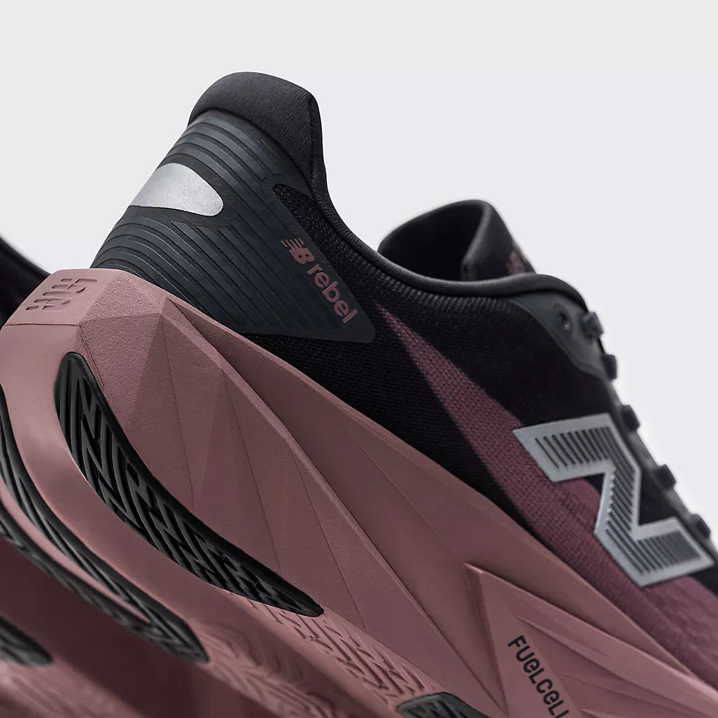 Close up of new balance fuelcell rebel for women, showing sole, magnet with pebble colour