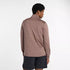 Man wearing new balance heat grid half zip run top in earth shadow colour, showing back