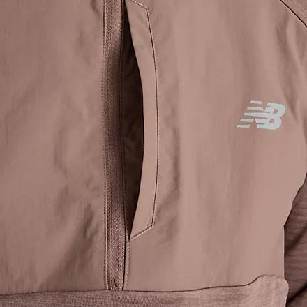 close up of pocket and logo detail on New Balance heat grid half zip run top