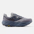 new balance hierro 9 for men, cushioned gravel trail running and walking shoe, dark grey blue colour, side profile of shoe on white background