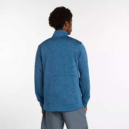 new balance athletics heat grid quarter zip for men, warm half zip running top, blue colour, man wearing blue half zip running jumper from behind