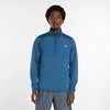 new balance athletics heat grid quarter zip for men, warm half zip running top, blue colour, man wearing blue half zip running jumper