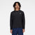nb athletics long sleeve shirt for men, breathable long sleeve shirt good for layering, black colour, man wearing black nb long sleeve with silver nb logo and navy shorts