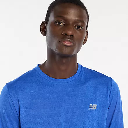 new balance athletics long sleeve shirt for men, lightweight breathable long sleeve top, royal blue colour, close up neckline of man wearing blue nb long sleeve top