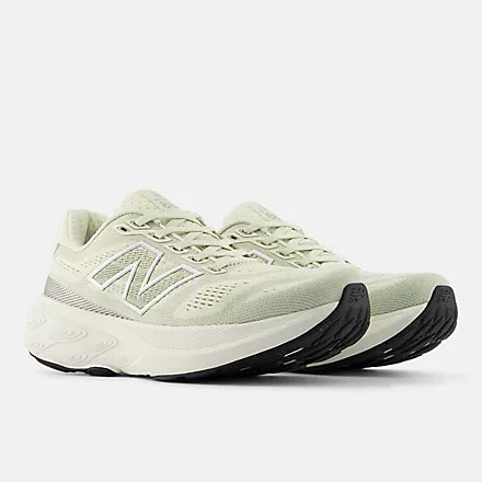 new balance 880v15 Light green running shoe with black sole on a white background