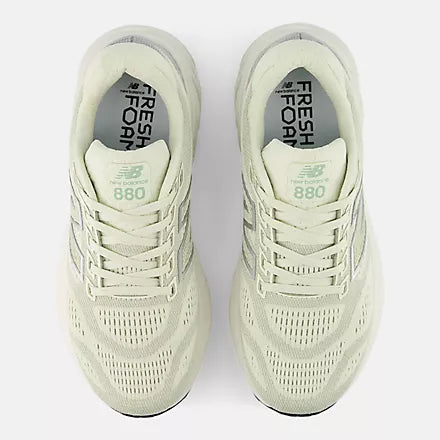 new balance 880v15 pair of light green running shoes with 'Fresh Foam' and 'New Balance' branding