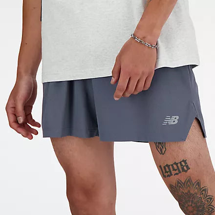 new balance rc short for men, lightweight 5in length running short, grey colour, close up of man wearing grey nb shorts