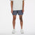 new balance rc short for men, lightweight 5in length running short for men, grey colour, male model chest down wearing grey nb shorts and white shirt with white shoes