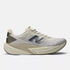 new balance rebel v5 for men, lightweight cushioned running shoe for long and short distance runs, light grey running shoe with greyish purple logo, side profile of new balance running shoe