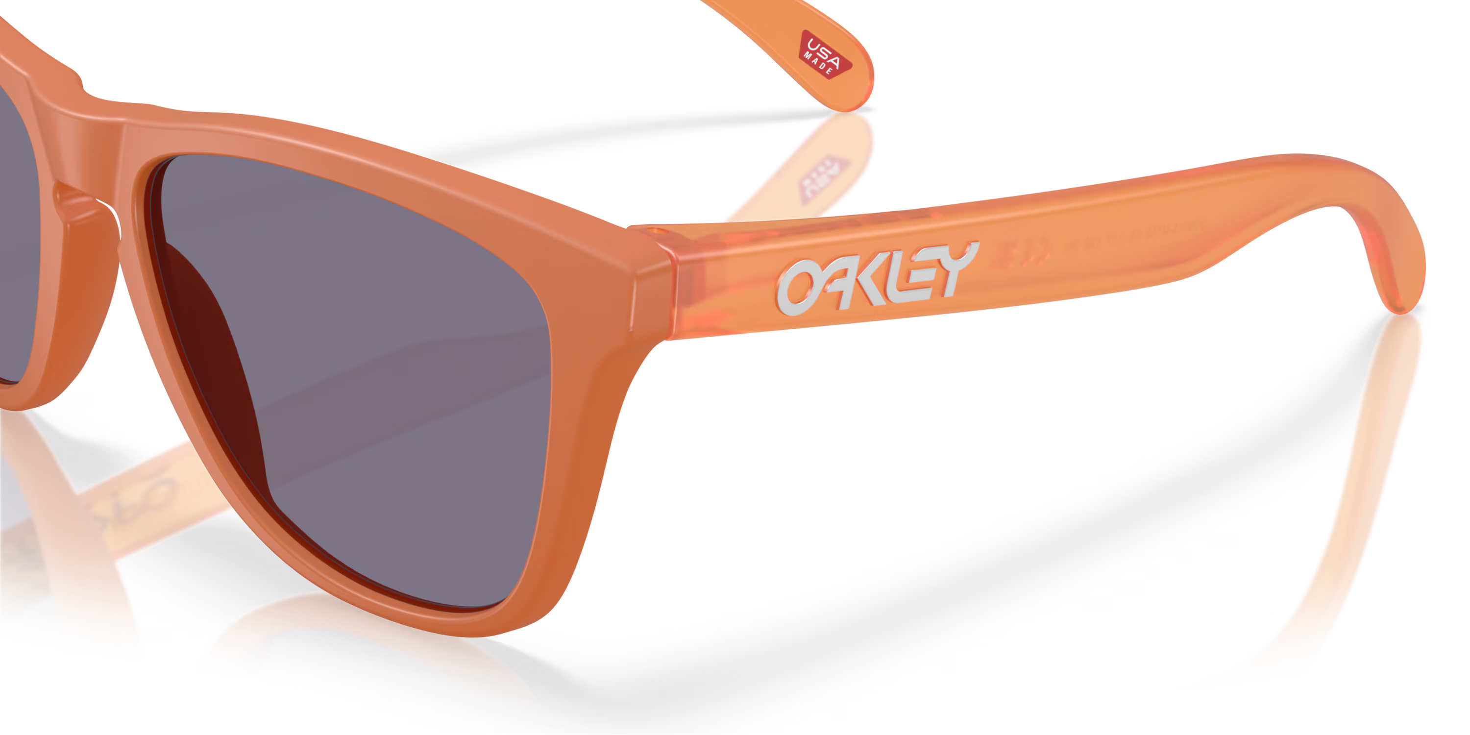 oakley frogskins sunglasses with a prizm grey lens and matte ginger frame