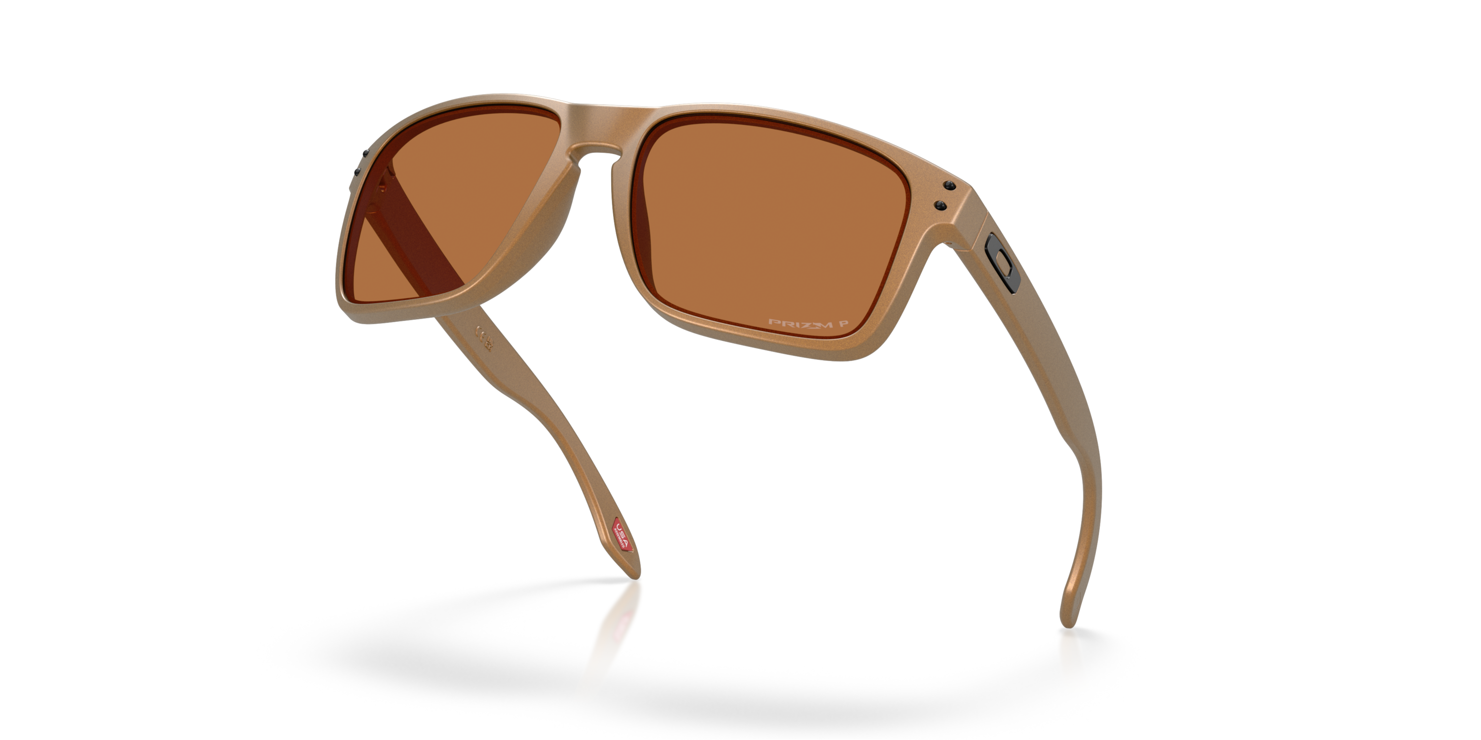 Oakley holbrook XL alloy sunglasses, bronze frame and bronze Polarized lenses. Highly durable with all day comfort. low down view of sunglasses.