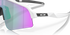 oakley sutro lite sweep sunglasses. A functional sport design with optimised coverage, extended field-of-view, retention and impact protection. White frame with green and purple lenses. Close up view of lens and frame. 