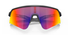 oakley sutro lite sweep sunglasses, wide field of view for cycling and running , red yellow and pruple lense with grey black frame, front of glasses with arms crossed