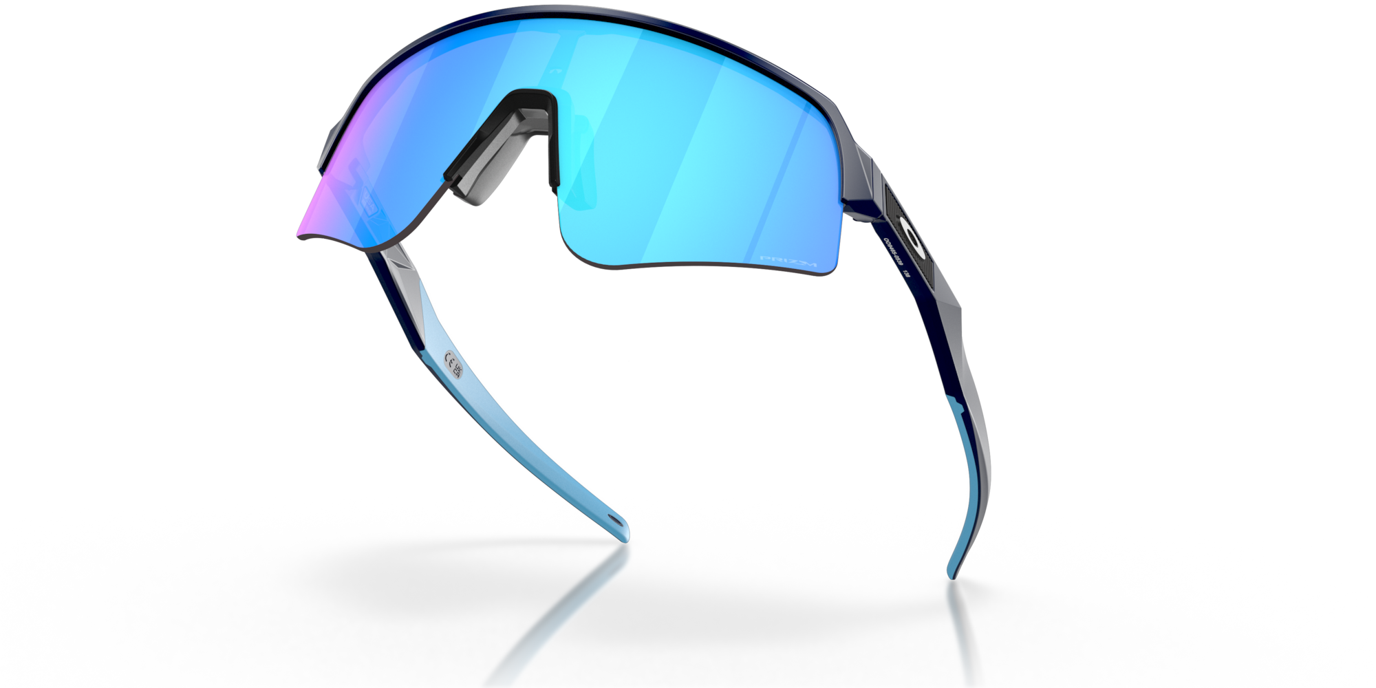 oakley sutro lite sweep sunglasses. A functional sport design with optimised coverage, extended field-of-view, retention and impact protection. navy frame with blue and purple lenses. low view of glasses.